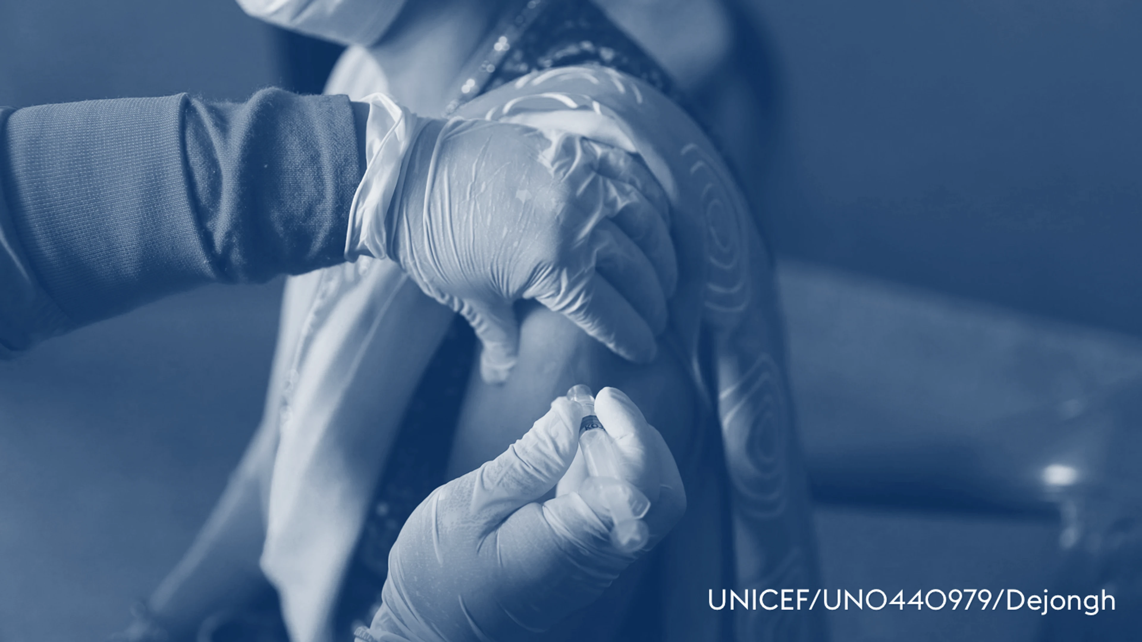 A health worker receiving COVID-19 vaccine in their left arm in Nepal
